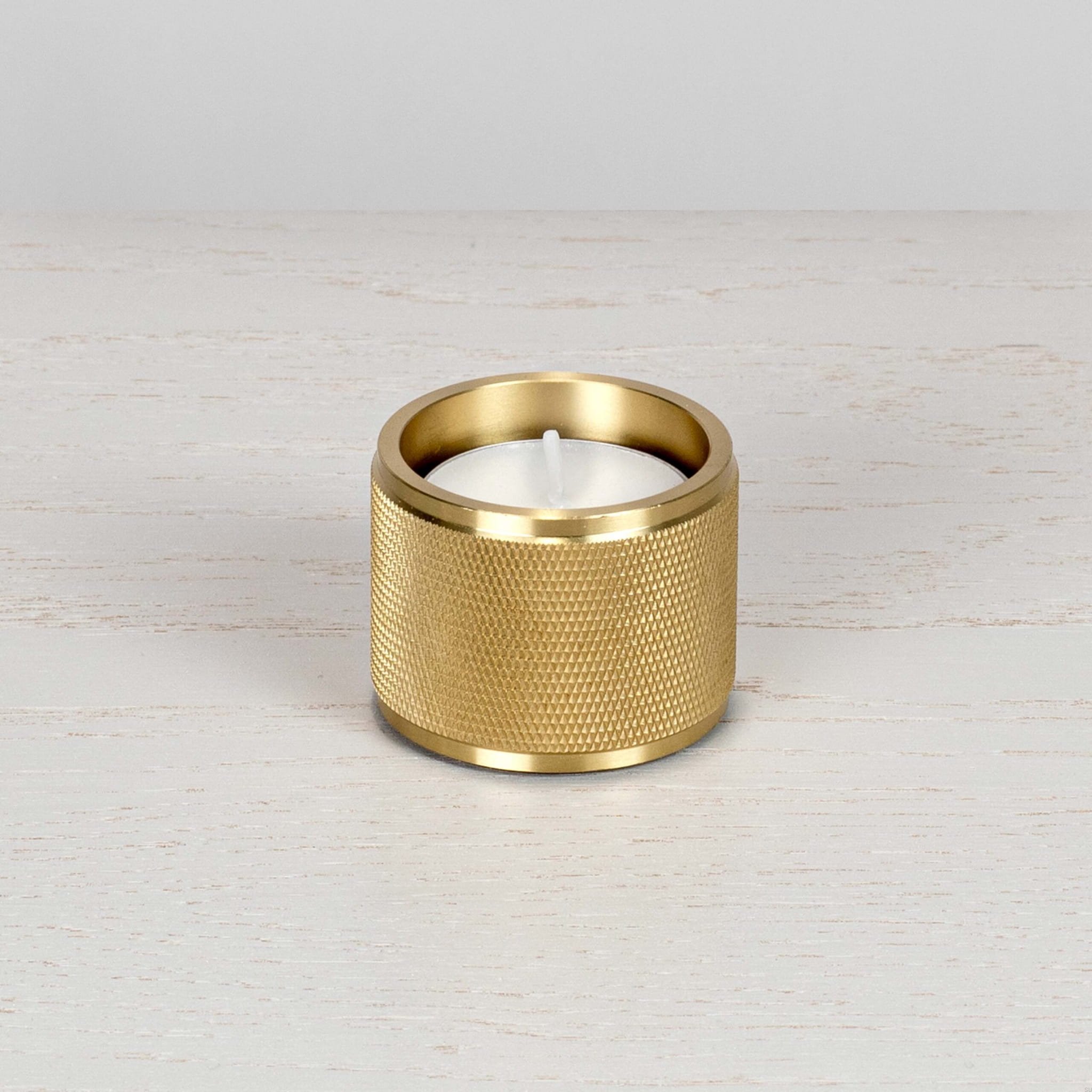 1.BusterPunch_Tealight_Candle_Holder__Brass_Front_off-1-scaled.jpg